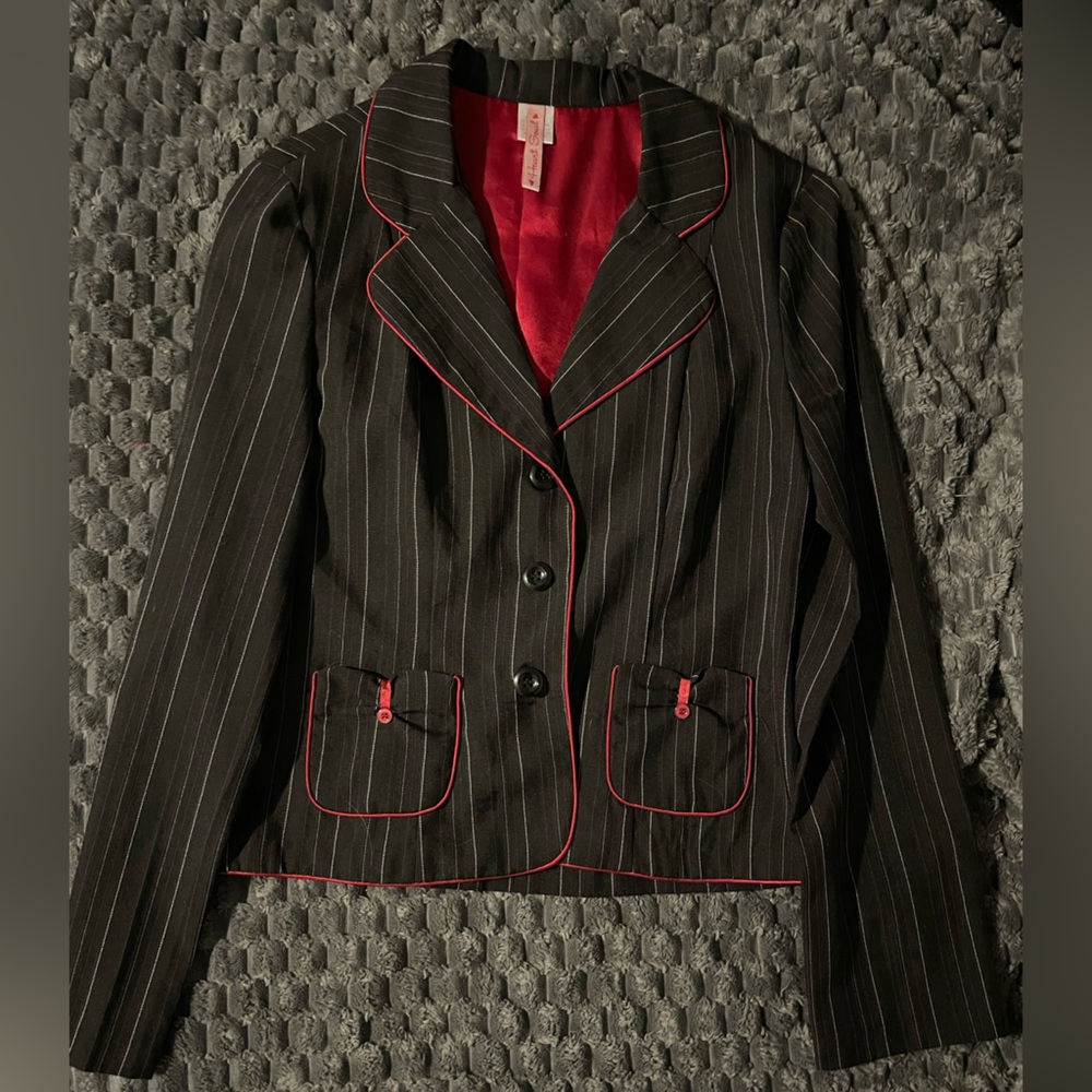 Size medium black blazer with white and red pin stripes. 3 button, 2 pockets.